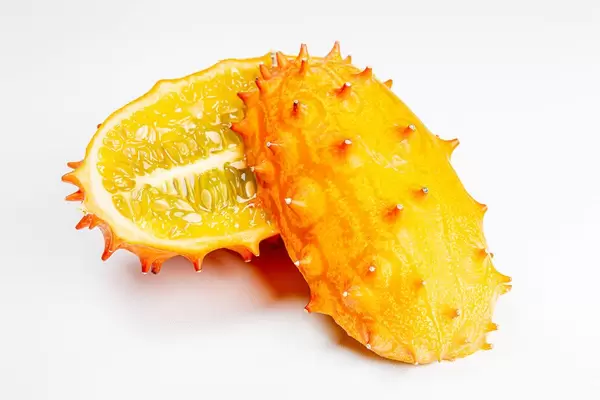 Halves kiwano fruit or horned melon on white background