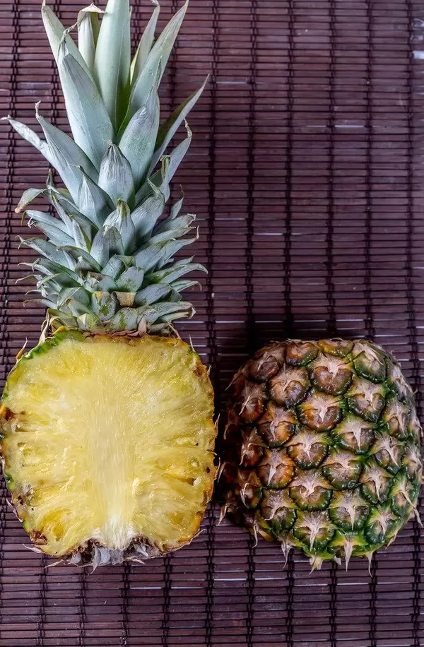 Halves of ripe fresh pineapple