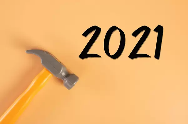 Hammer with 2021 text on orange background