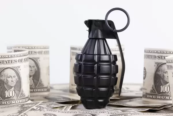Hand grenade and Dollar banknotes