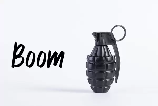 Hand grenade with Boom text on white background
