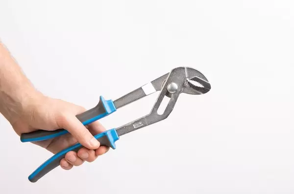 Hand holding adjustable water pump pliers