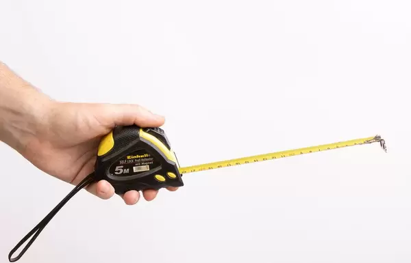 Hand holding building meter