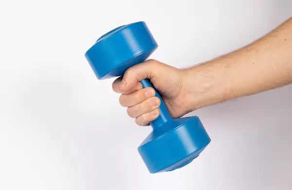 Hand holding dumbbell on white background (Flip 2019)