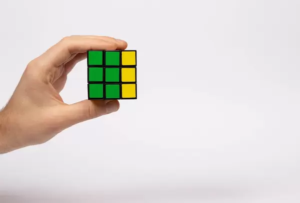Hand holding Rubik's cube