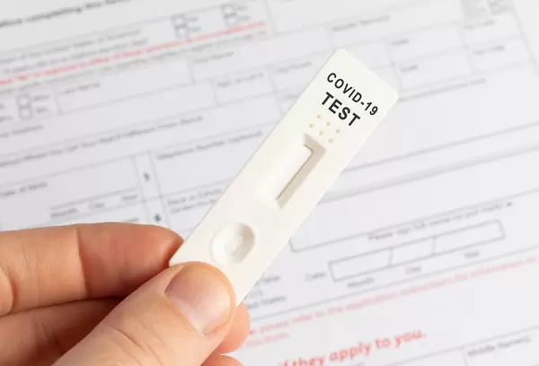 Hand holds a covid-19 antigen test