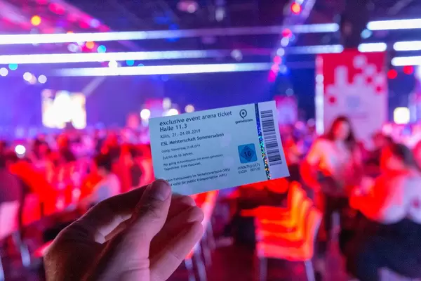 Hand holds an exclusive Gamescom event arena ticket  for the ESL championship summer season