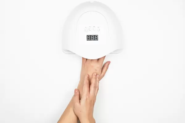 Hand in UV lamp lights for nails