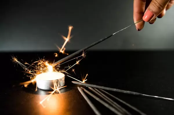Hand lighting a sparkler