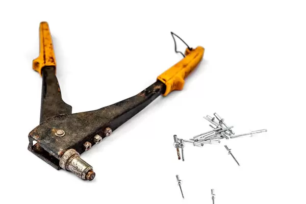 Hand rivet gun on white background