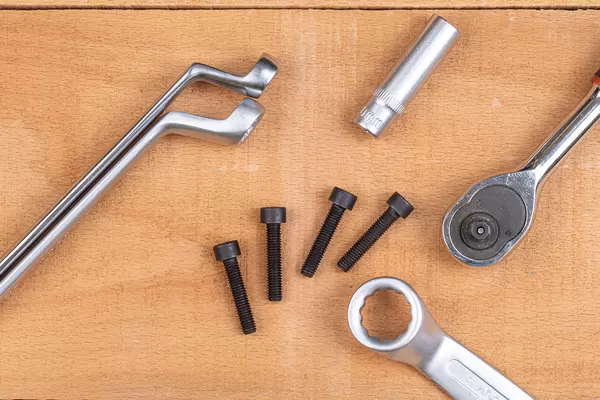 Hand tools with Inbus screws on the wooden table