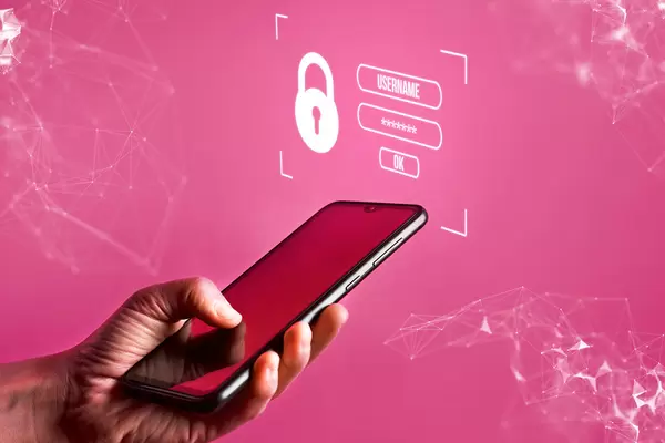 Hand typing username and password on his account