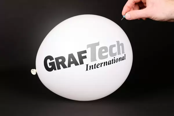 Hand uses a needle to burst a balloon with GrafTech logo