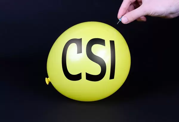 Hand uses a needle to burst a yellow balloon with CSI text