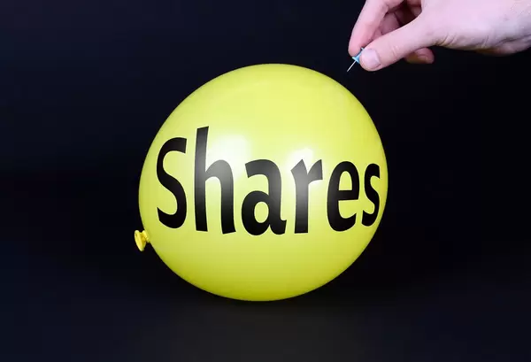 Hand uses a needle to burst a yellow balloon with Shares text