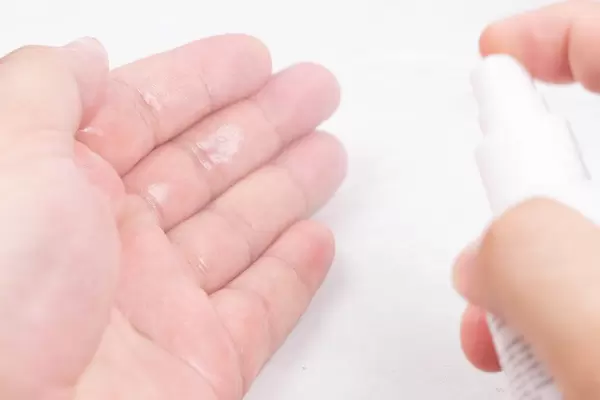 Hand with hygiene care with Alcohol spray