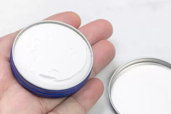 Hand with white cream and healthy concept