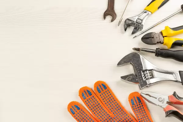 Hand working tools on wooden background with free space