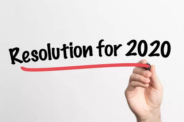 Hand writing Resolution for 2020 on whiteboard