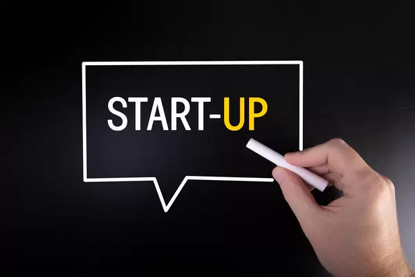 Hand writing Start-up on blackboard