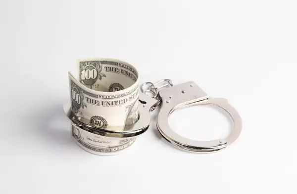 Handcuffs and money