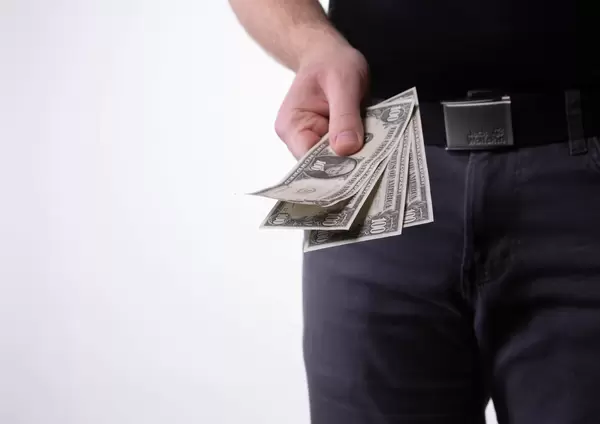 Hands giving money on white background