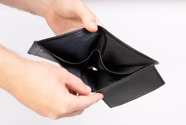 Hands showing empty wallet