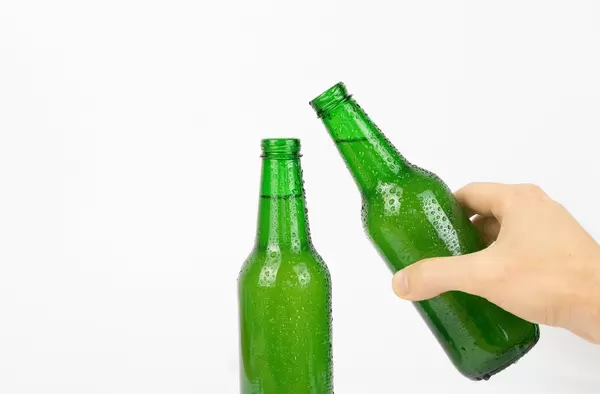 Hands toasting with beer