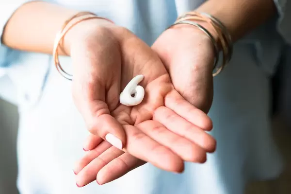Hands with a curl of hand cream