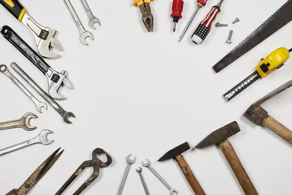 Handy tools on white background with copy space in the middle