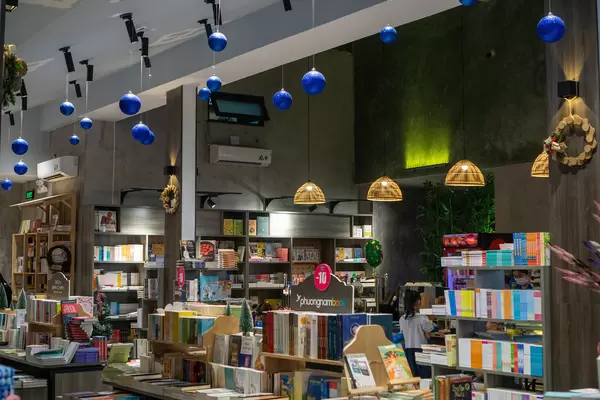 Hanging Christmas Ornaments and Hanging Ceiling Lamps in a Modern Bookstore with Cafe in Ho Chi Minh City, Vietnam