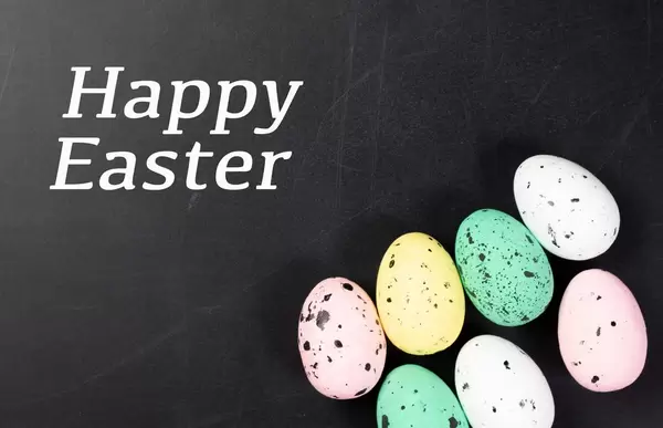 Happy Easter text with colorful Easter eggs