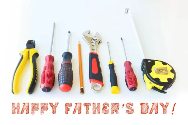 Happy Father's day symbolised with manual working tools