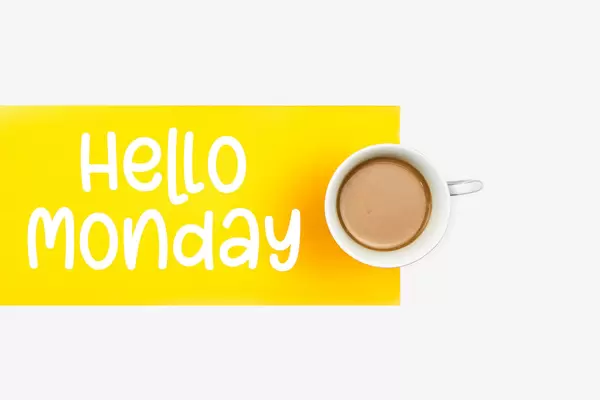 Happy monday concept with cup of coffee on white background