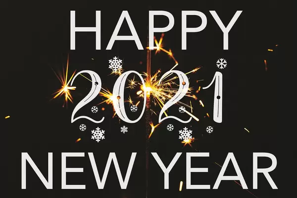 Happy new 2021 year greetings on black background with sparkler