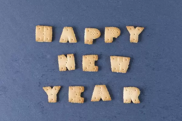 Happy New Year biscuits letters, black background