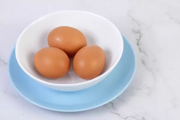 Hard Boiled Eggs in the bowl above grey marble table (Flip 2019)