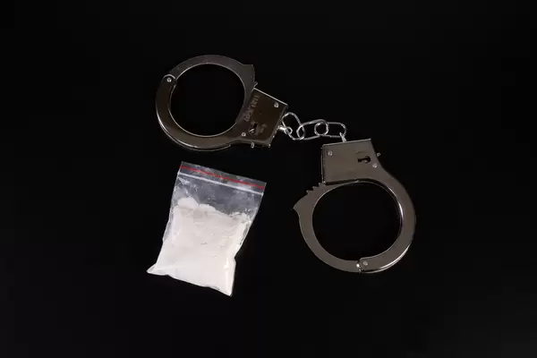 Hard drugs and handcuffs