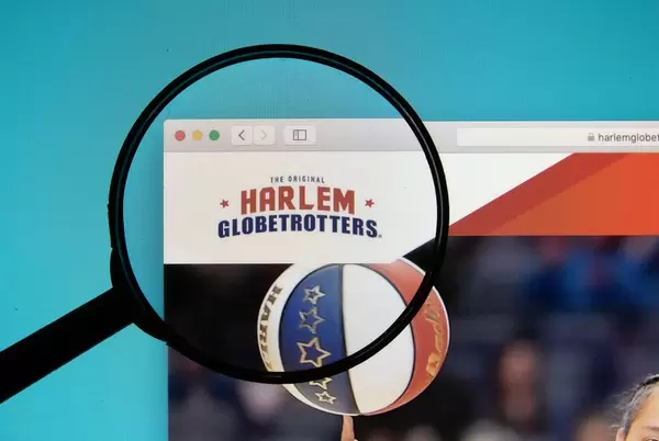 Harlem Globetrotters logo on a computer screen with a magnifying glass