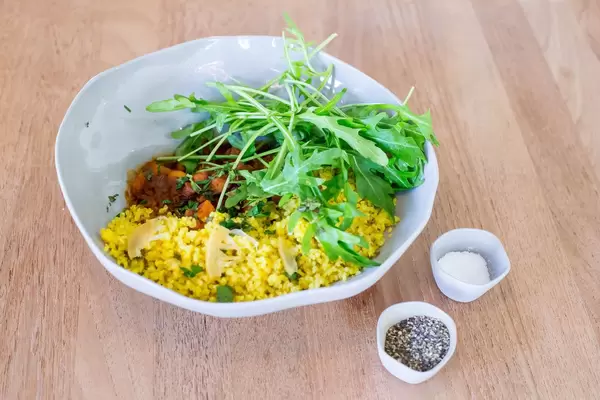 Harvest Tajine Bowl: morrocan vegetable with dried fruit, fresh herbs, roasted almonds and safran bulgur