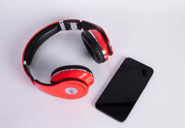 Headphones and smartphone on a white background