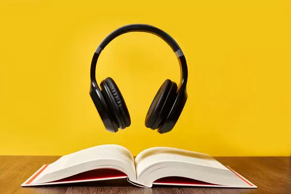 Headphones over open pages of a book