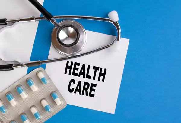 Health care written on medical blue folder