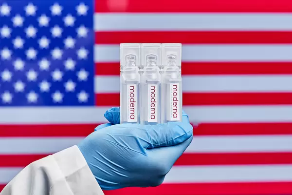 Healthcare system worker holds American vaccine from Moderna