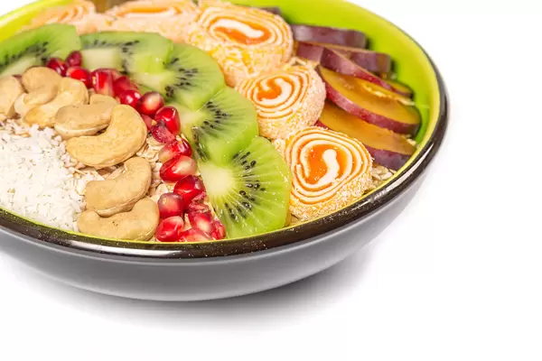 Healthy breakfast oatmeal with fruits and turkish delight, close-up