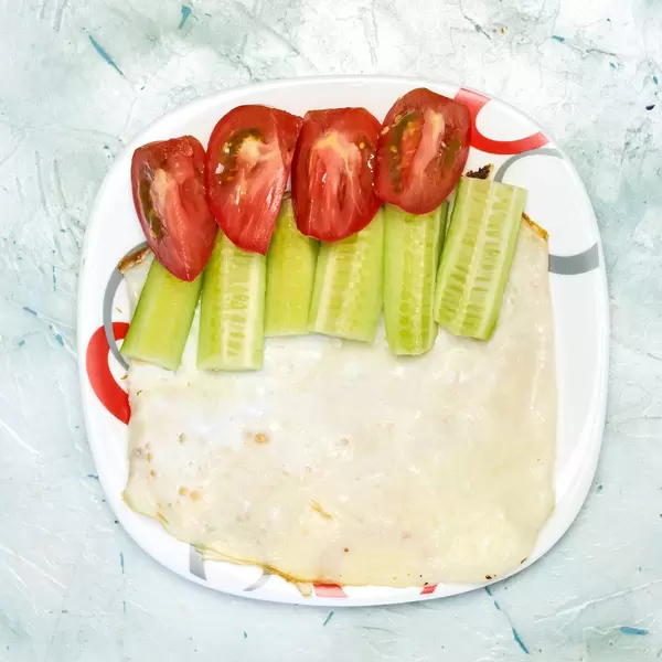 Healthy breakfast with a homemade omelet (or omelette) and fresh vegetables