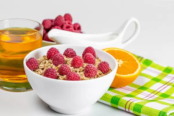 Healthy breakfast with oatmeal, milk and fresh fruit