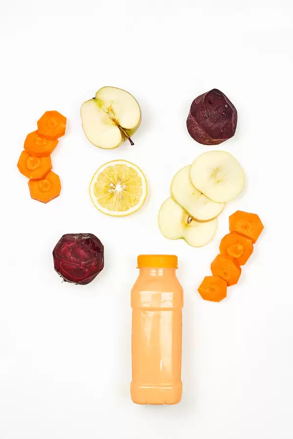 Healthy dieting smoothie with beetroot, carrot, lemon and apple slices