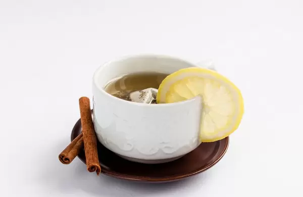 Healthy fruit tea with lemon and cinnamon