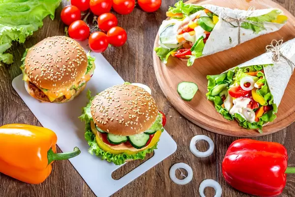 Healthy homemade fast-food with burgers and veggie tortillas